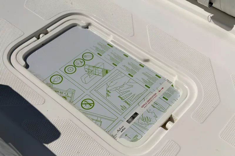 Slide: The Image of Caribe MVP11 2025 boat hatch with instructional diagrams. - 14