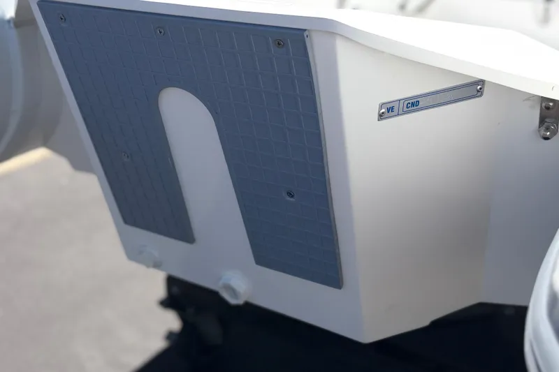 Slide: The Image of Close-up of a Caribe MVP11 2025 boat component with textured panel and label. - 19