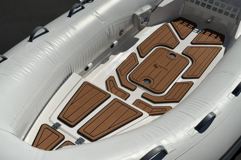 Slide: The Image of Inflatable boat interior with custom brown flooring, Caribe MVP11, 2025 model. - 27