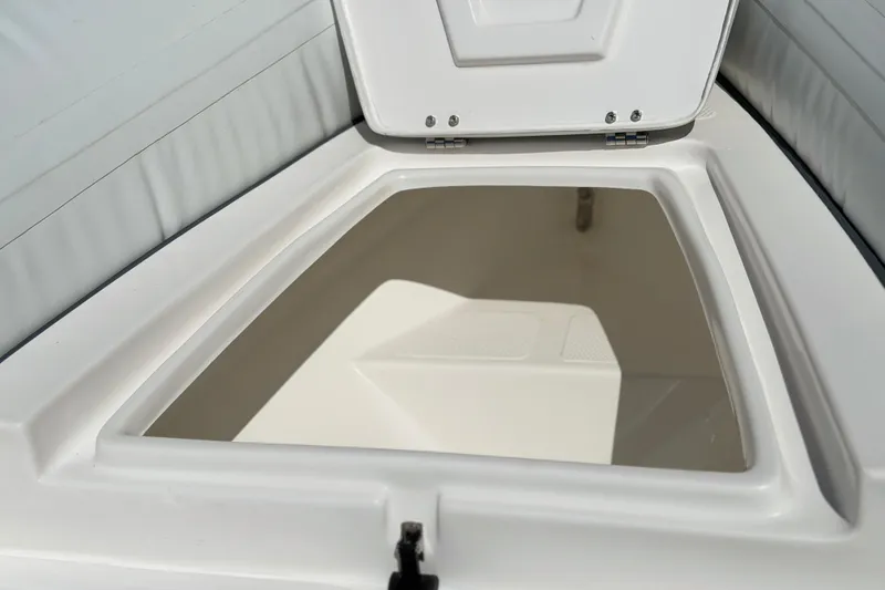 Slide: The Image of Open storage compartment in 2025 Caribe MVP11 boat. - 6
