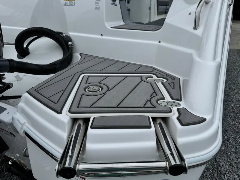 Slide: The Image of 2025 NauticStar 243 DC Deck boat swim platform with stainless steel ladder. - 10