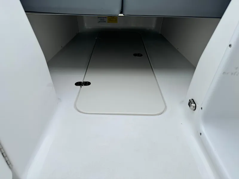 Slide: The Image of 2025 NauticStar 243 DC Deck boat interior storage compartment. - 31