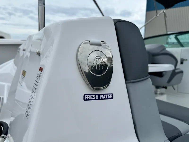 Slide: The Image of 2025 NauticStar 243 DC Deck boat with fresh water access. - 35