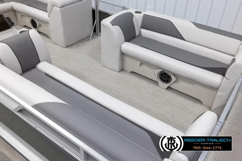 Slide: The Image of 2025 Avalon VENT CRB boat interior with gray and white seating, featuring built-in speakers. - 10