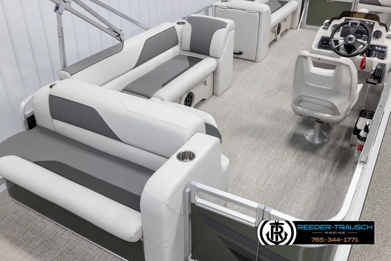 Slide: The Image of 2025 Avalon VENT CRB boat interior with gray seating and modern helm. - 13