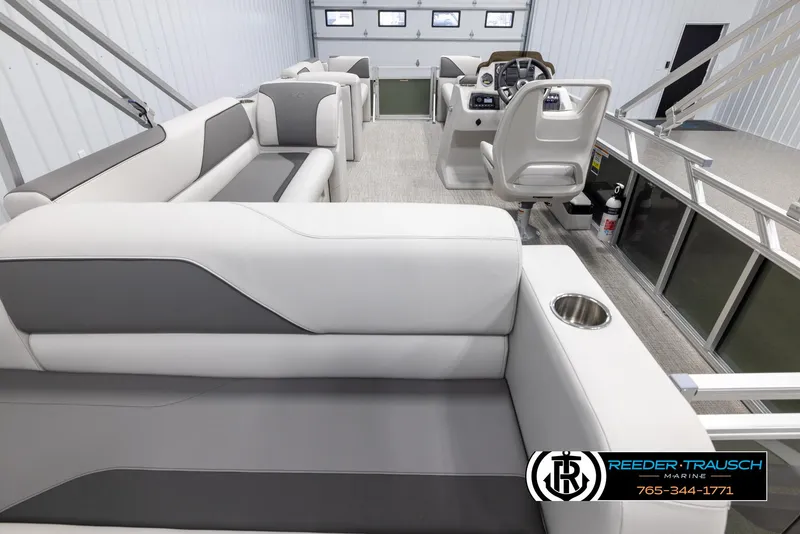 Slide: The Image of 2025 Avalon VENT CRB boat interior with modern seating and steering console. - 17