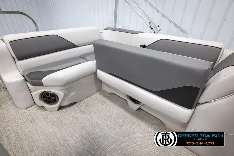 Slide: The Image of 2025 Avalon VENT CRB boat interior with gray and white seating, featuring built-in speakers. - 24