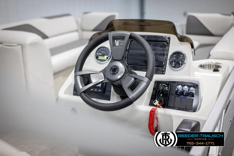Slide: The Image of 2025 Avalon VENT CRB boat dashboard with steering wheel and control panel. - 28
