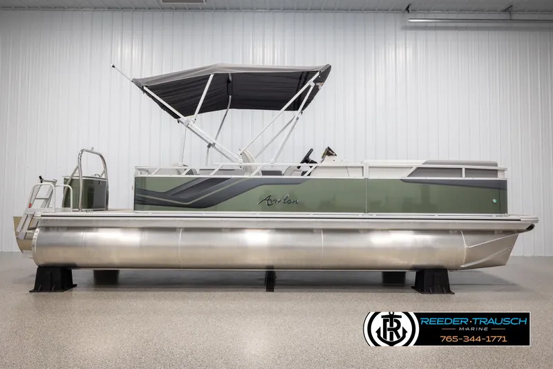 Slide: The Image of 2025 Avalon VENT CRB pontoon boat with canopy in showroom. - 6