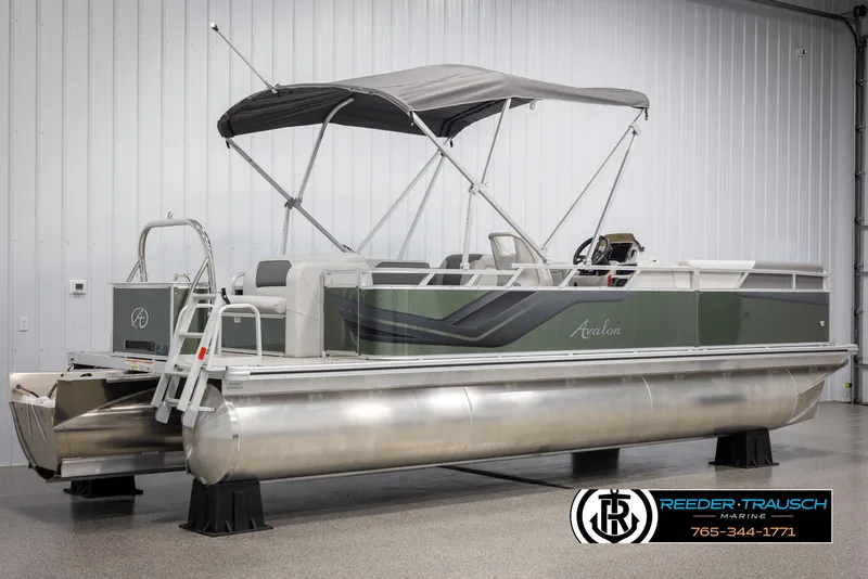 Slide: The Image of 2025 Avalon VENT CRB pontoon boat with canopy in showroom. - 7