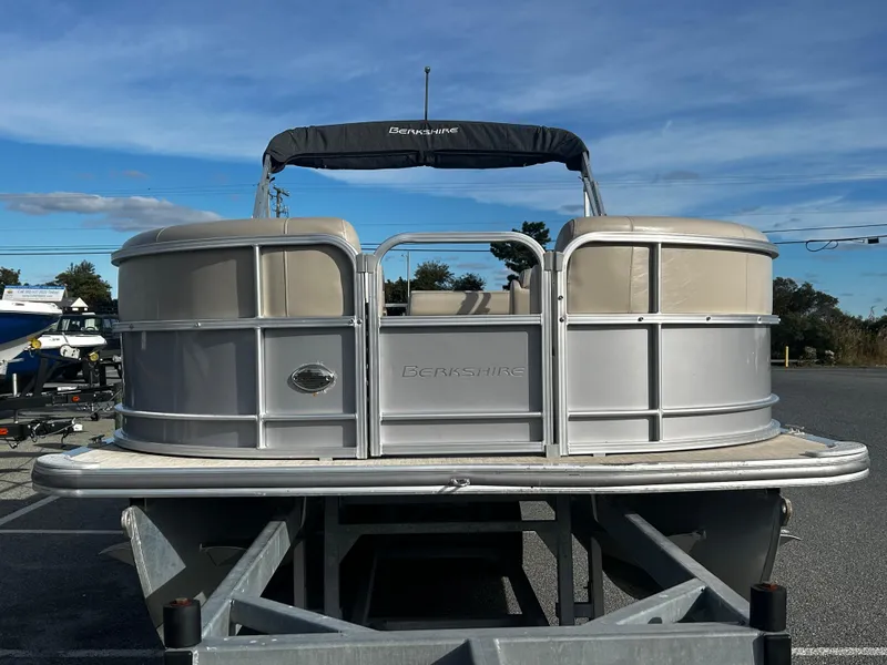 Slide: The Image of 2018 Berkshire 22CL CTS pontoon boat on trailer, sunny day. - 1