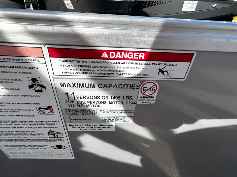 Slide: The Image of Warning label on 2018 Berkshire 22CL CTS boat detailing safety and capacity limits. - 14