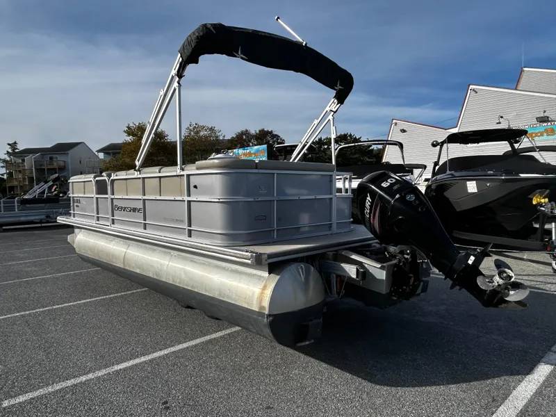 Slide: The Image of 2018 Berkshire 22CL CTS pontoon boat with outboard motor in parking lot. - 3