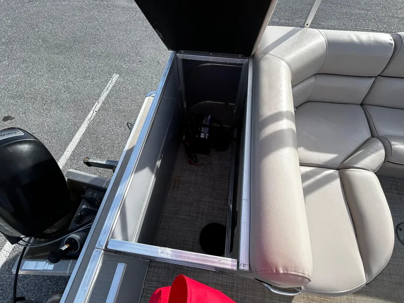 Slide: The Image of 2018 Berkshire 22CL CTS pontoon boat with open storage compartment and seating. - 6