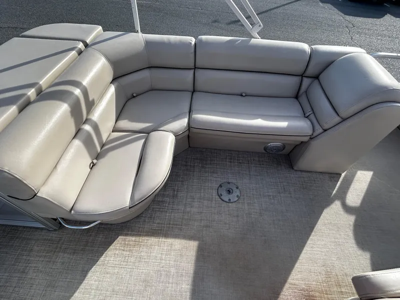 Slide: The Image of 2018 Berkshire 22CL CTS boat interior with beige seating. - 7