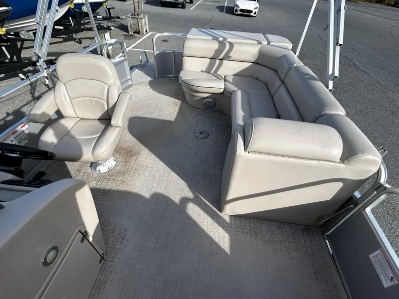 Slide: The Image of 2018 Berkshire 22CL CTS pontoon boat interior with beige seating and spacious layout. - 8