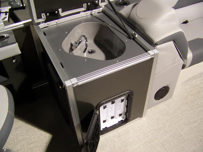 Slide: The Image of 2025 Avalon GeoFish23RF boat interior with built-in sink and storage compartment. - 5