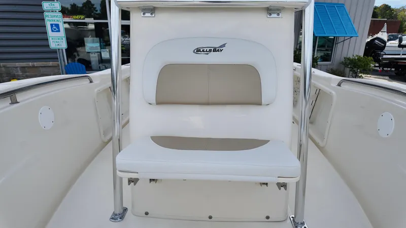 Slide: The Image of 2025 Bulls Bay 200CC boat interior with cushioned seating and sleek design. - 11