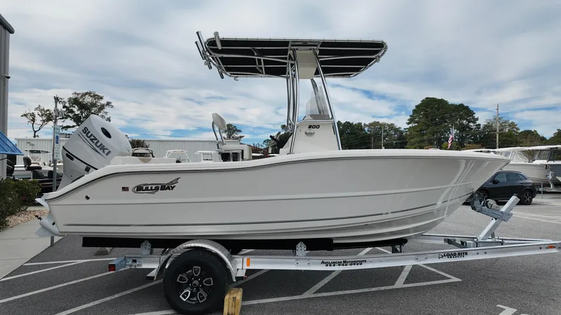 Slide: The Image of 2025 Bulls Bay 200CC boat on trailer, side view, parked outdoors. - 3