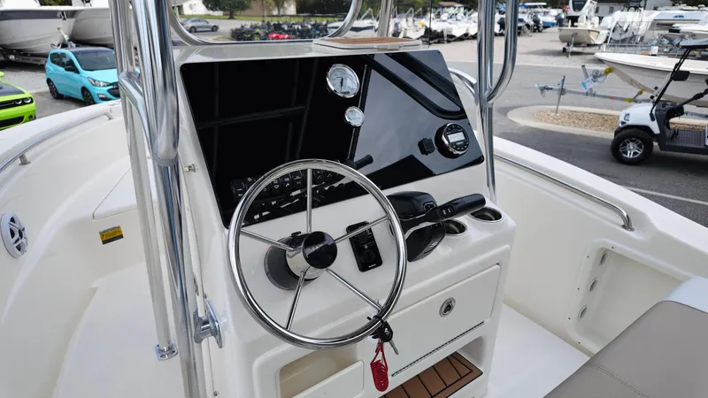 Slide: The Image of 2025 Bulls Bay 200CC boat dashboard with steering wheel and controls. - 6