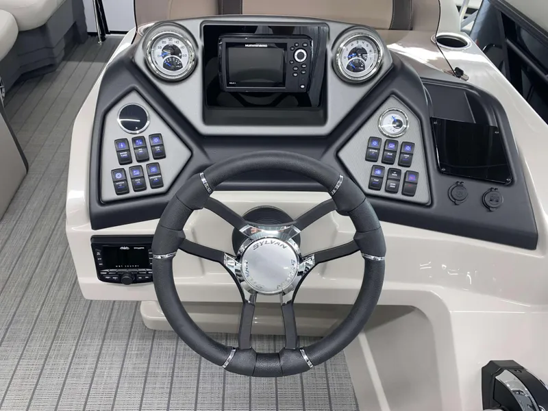 Slide: The Image of 2025 Sylvan L1 LZ boat dashboard with steering wheel and control panel. - 10