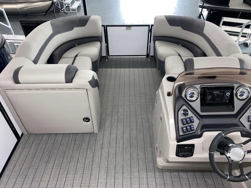 Slide: The Image of 2025 Sylvan L1 LZ boat interior with modern dashboard and plush seating. - 12