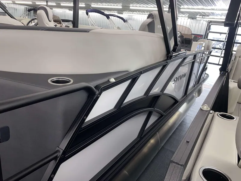 Slide: The Image of 2025 Sylvan L1 LZ pontoon boat interior with sleek design and comfortable seating. - 2