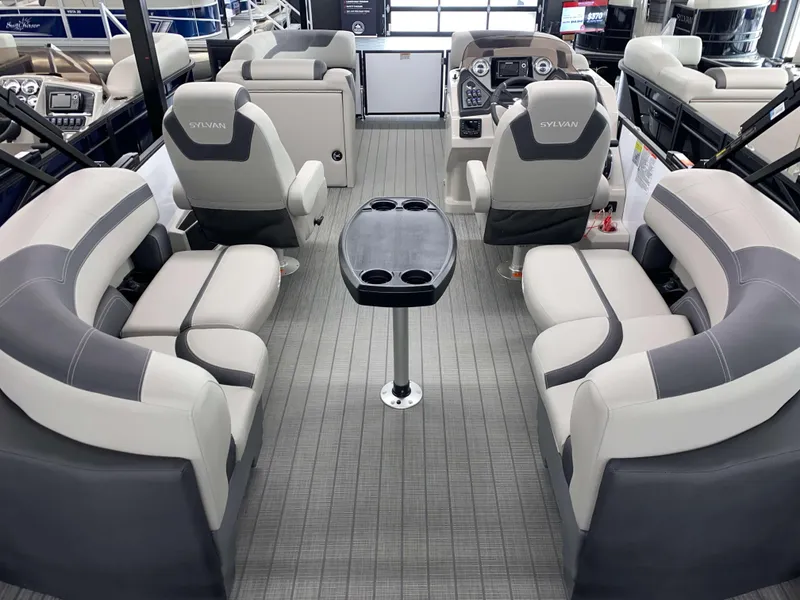 Slide: The Image of 2025 Sylvan L1 LZ boat interior with gray seating and central table. - 4