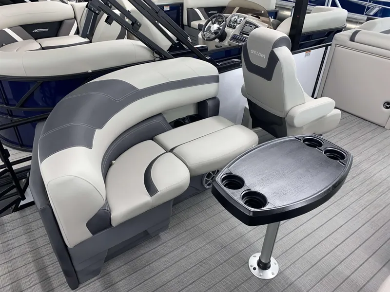 Slide: The Image of 2025 Sylvan L1 LZ boat interior with seating and table, featuring Mercury 115HP engine. - 6