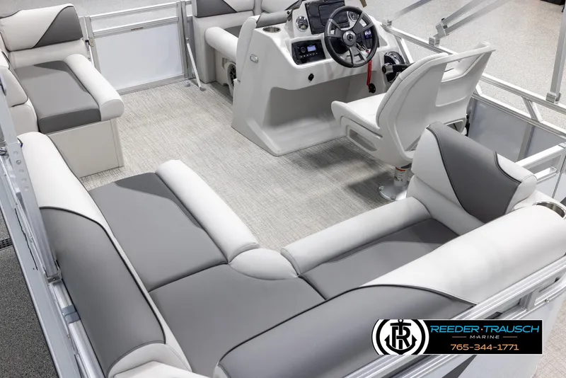 Slide: The Image of 2025 Avalon VENT CR boat interior with gray and white seating, steering console, and carpeted floor. - 12