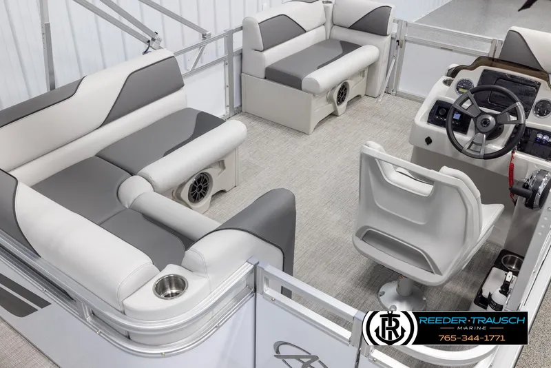 Slide: The Image of 2025 Avalon VENT CR boat interior with gray seating and modern dashboard. - 13
