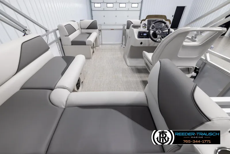 Slide: The Image of 2025 Avalon VENT CR boat interior with modern seating and steering console. - 16