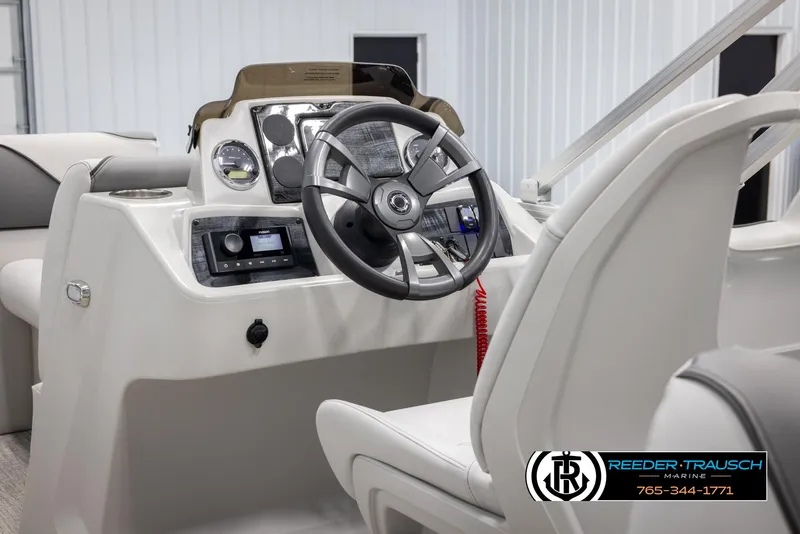 Slide: The Image of 2025 Avalon VENT CR boat dashboard with steering wheel and controls. - 22