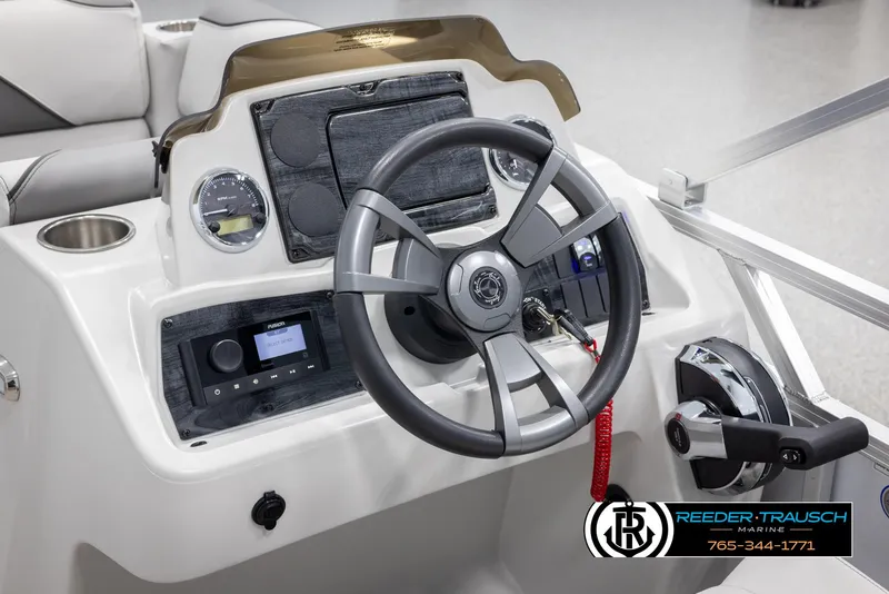 Slide: The Image of 2025 Avalon VENT CR boat dashboard with steering wheel and control panel. - 23