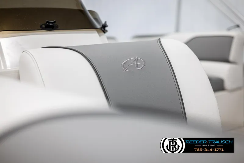 Slide: The Image of 2025 Avalon VENT CR boat seat with logo, featuring white and gray upholstery. - 32