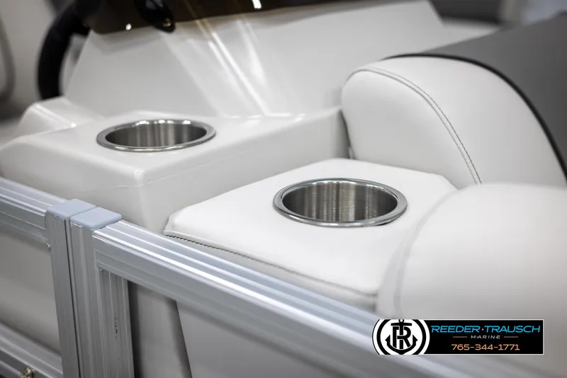 Slide: The Image of 2025 Avalon VENT CR boat interior with cup holders and white seating. - 33