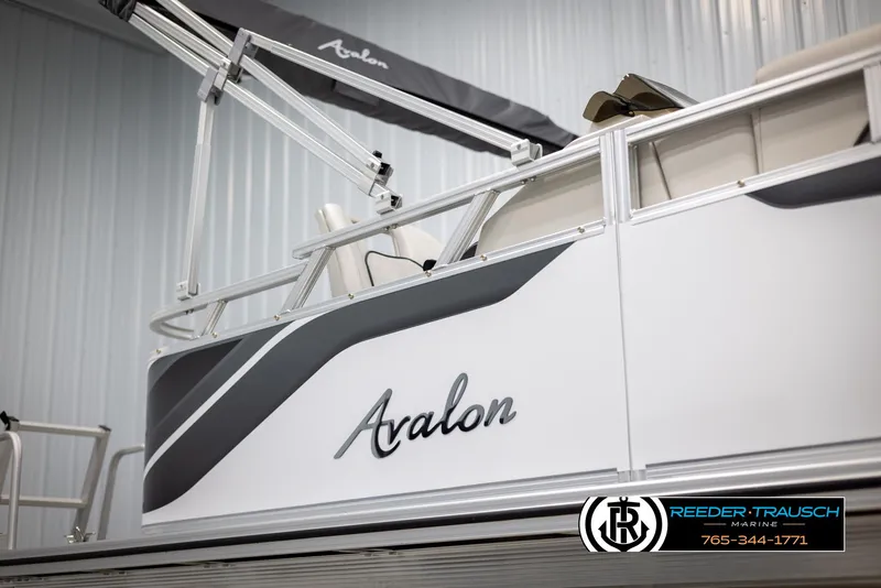 Slide: The Image of 2025 Avalon VENT CR boat with sleek design in showroom. - 38