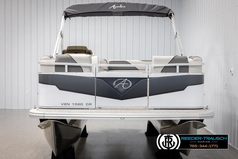 Slide: The Image of Avalon VENT CR 2025 pontoon boat, rear view, in showroom setting. - 9
