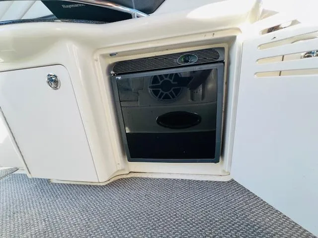 Slide: The Image of 2004 Sea Ray 390 Sundancer interior with built-in mini fridge. - 12