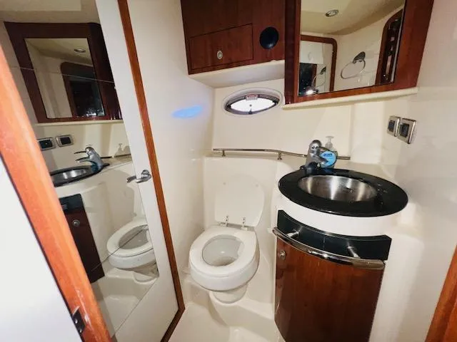 Slide: The Image of Luxurious bathroom in 2004 Sea Ray 390 Sundancer yacht with modern fixtures. - 19