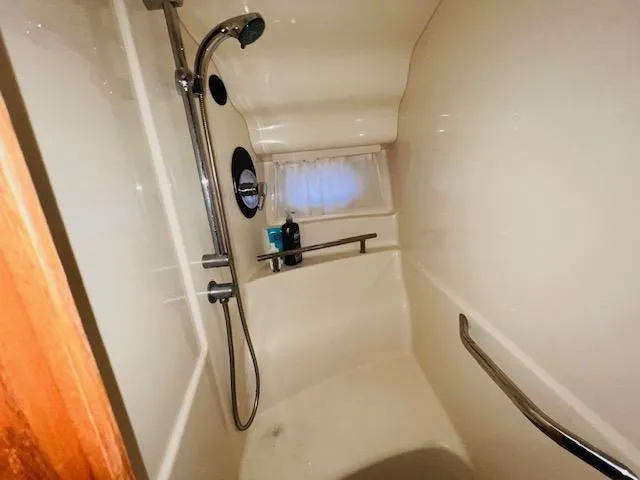 Slide: The Image of Shower area in 2004 Sea Ray 390 Sundancer yacht, featuring modern fixtures. - 20
