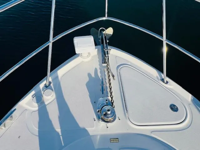 Slide: The Image of Bow of 2004 Sea Ray 390 Sundancer with anchor and railing. - 5