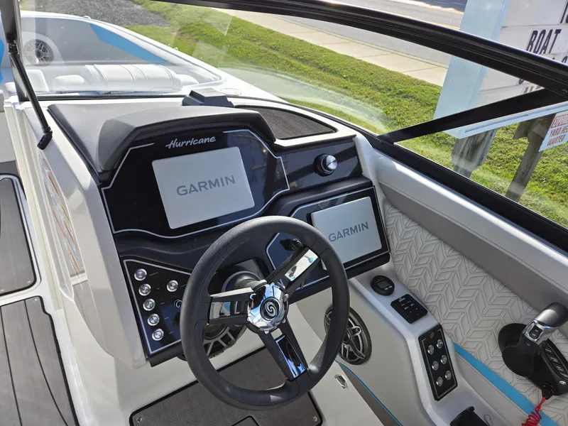 Slide: The Image of 2025 Hurricane SunDeck 2600 OB boat dashboard with Garmin navigation system. - 16
