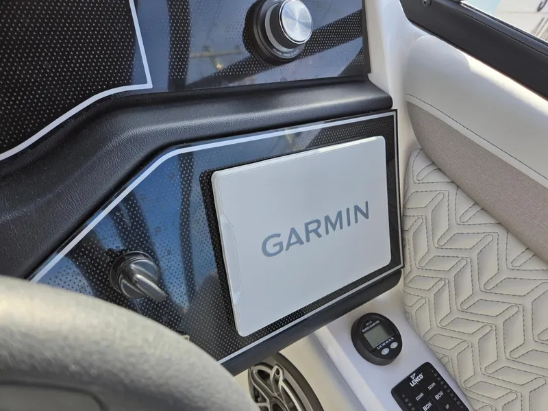 Slide: The Image of Garmin navigation system on 2025 Hurricane SunDeck 2600 OB boat dashboard. - 18