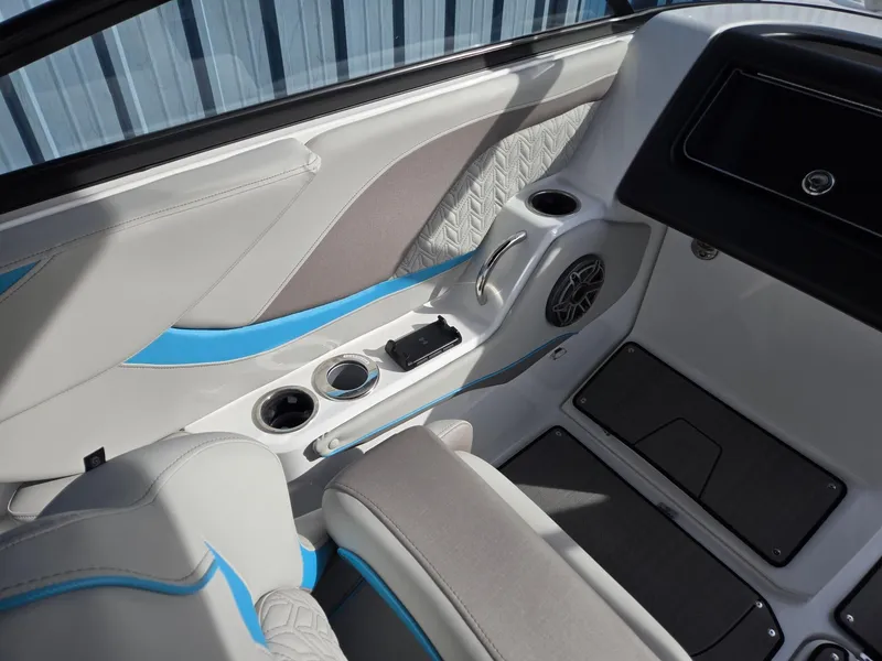 Slide: The Image of 2025 Hurricane SunDeck 2600 OB interior with modern design, cup holders, and speaker system. - 22