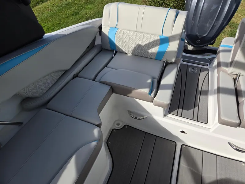 Slide: The Image of 2025 Hurricane SunDeck 2600 OB boat interior with cushioned seating and modern design. - 26