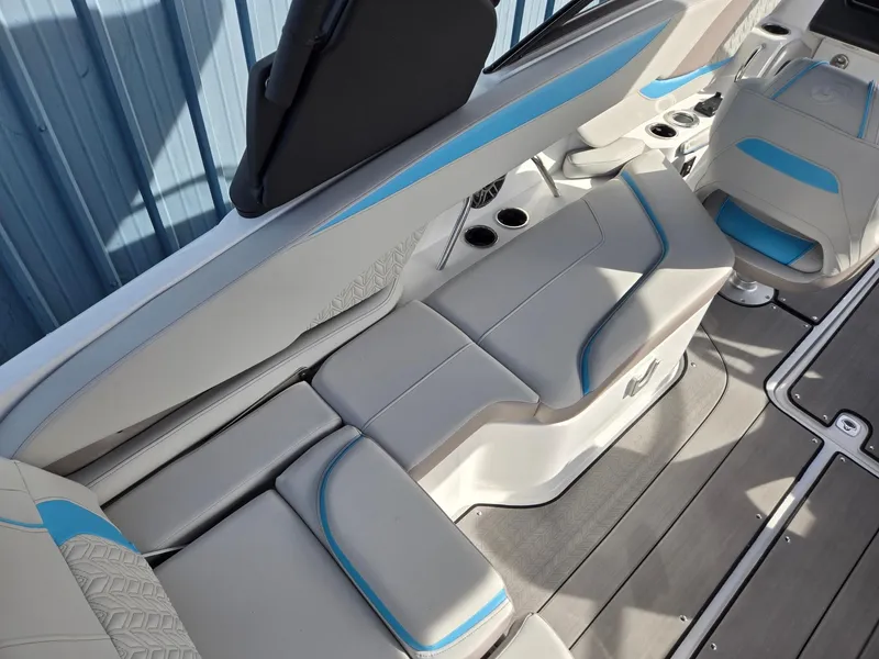 Slide: The Image of 2025 Hurricane SunDeck 2600 OB boat interior with sleek seating and modern design. - 34