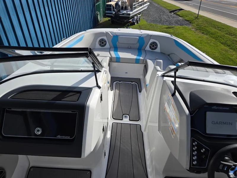 Slide: The Image of 2025 Hurricane SunDeck 2600 OB boat interior with modern dashboard and seating. - 37