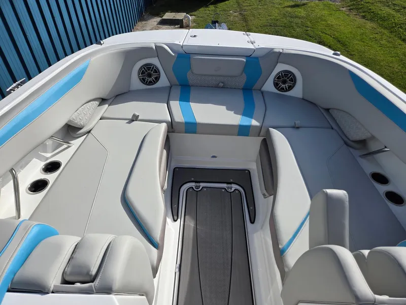 Slide: The Image of 2025 Hurricane SunDeck 2600 OB boat interior with blue and gray seating. - 38