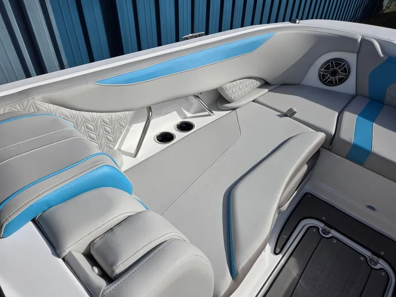 Slide: The Image of 2025 Hurricane SunDeck 2600 OB boat interior with blue and gray seating. - 39